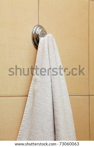 dry towel hangs on a hook