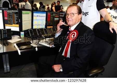 Roger Moore on the trading floor of BGC as part of the BGC Charity Day 2012, Canary Wharf, London. 11/09/2012 Picture by: Steve Vas