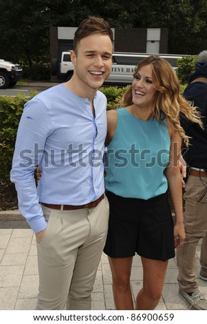 new X Factor Extra presenters, Olly Murs and Caroline Flack arrive for the first auditions of the new series of X Factor at the LG Stadium, Birmingham. 01/06/2011  Picture by: Steve Vas / Featureflash
