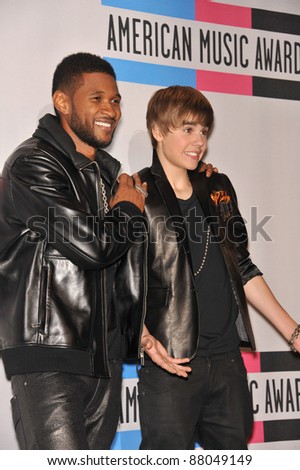 Usher & Justin Bieber (right) at the 2010 American Music Awards at the Nokia Theatre L.A. Live in downtown Los Angeles. November 21, 2010  Los Angeles, CA Picture: Paul Smith / Featureflash