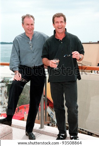 Actor/producer MEL GIBSON (right) & business partner BRUCE DAVEY at the 1999 Cannes Film Festival where they\'re promoting their movie company Icon Entertainment.  Paul Smith / Featureflash
