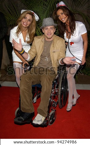 JUSTIN TIMBERLAKE of \'NSync - with nurses to help him due to his broken foot - at the 2002 Billboard Music Awards at the MGM Grand, Las Vegas. 09DEC2002