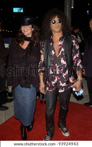 Singer SLASH, of Guns and Roses, & date at opening night party for Rolling Stone Ronnie Wood\'s art exhibition, in west Hollywood. 01NOV2002.   Paul Smith / Featureflash