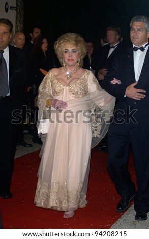 Actress DAME ELIZABETH TAYLOR arriving at the amfAR Cinema Against AIDS Gala at the Moulin de Mougins restaurant just outside Cannes. 23MAY2002.  Paul Smith / Featureflash