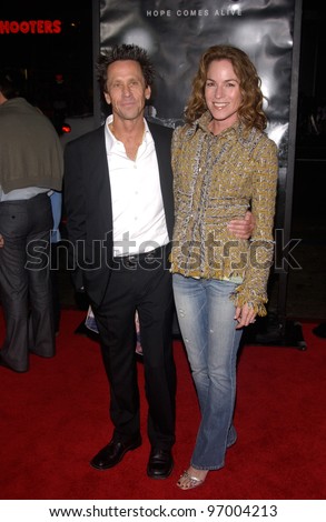 Producer BRIAN GRAZER & wife GIGI at the world premiere, in Hollywood, of his new movie Friday Night Lights. October 6, 2004