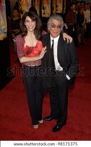 Actress JO CHAMPA with Italian designer ROBERTO CAVALLI at the world premiere, in Hollywood, of Crossroads. 11FEB2002.   Paul Smith/Featureflash