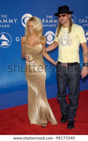 Actress PAMELA ANDERSON & rock star boyfriend KID ROCK at the 2002 Grammy Awards in Los Angeles.