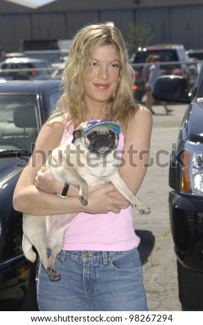 Actress TORI SPELLING & dog at the Best Friends Lint Roller Party at Santa Monica Airport, California. The event was held to benefit the Best Friends Animal Sanctuary.