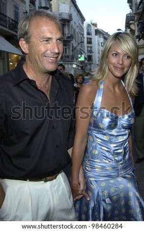 Actor KEVIN COSTNER & girlfriend at screening in Cannes of his new movie Open Range. 17MAY2003