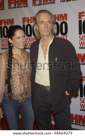 Actor DAVID CARRADINE & wife at party in Hollywood for FHM magazine to celebrate its 8th annual 100 Sexiest Women in the World special issue. June 5, 2003