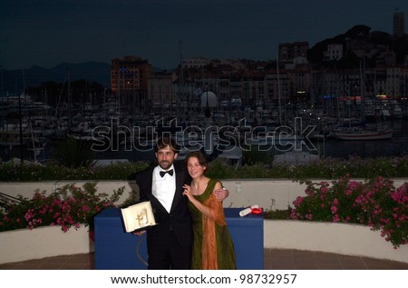Italian director NANNI MORETTI, with actress JASMINE TRINCA, celebrates winning the Palme D\'Or for his movie The Son\'s Room at the 54th Cannes Film Festival. 20MAY2001.  Paul Smith/Featureflash