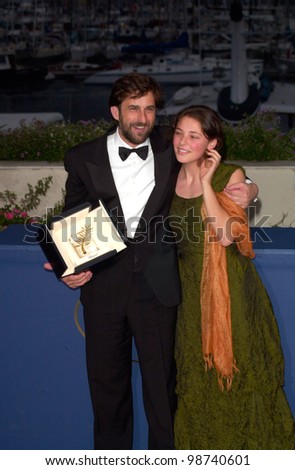 Italian director NANNI MORETTI, with actress JASMINE TRINCA, celebrates winning the Palme D\'Or for his movie The Son\'s Room at the 54th Cannes Film Festival. 20MAY2001.  Paul Smith/Featureflash