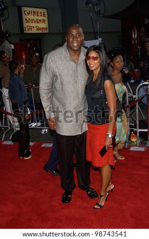 Basketball star EARVIN MAGIC JOHNSON & wife at the world premiere, at the Mann\'s Chinese Theatre, Hollywood, of Rush Hour 2. 26JUL2001   Paul Smith/Featureflash