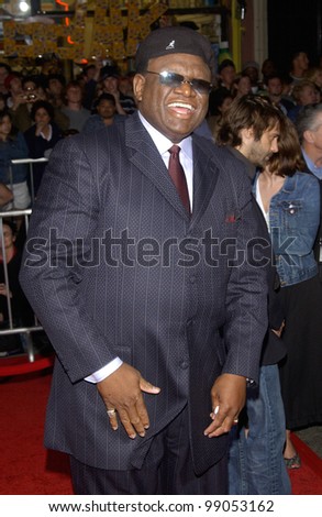Actor GEORGE WALLACE & date at the world premiere, in Hollywood, of his new movie The Ladykillers. March 12, 2004