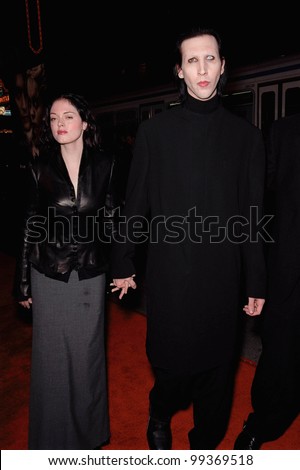 17NOV99:  Rock star MARILYN MANSON & actress girlfriend ROSE McGOWAN at the world premiere, in Hollywood, of  
