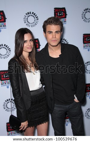 Paul Wesley and Torrey DeVitto at the opening of \