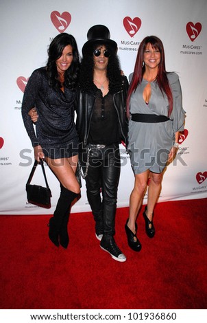 Janice Dickinson, Slash and wife Perla Ferrar at the 6th Annual Musicares MAP Fund Bevefit Concert celebrating women in  recovery, Club Nokia, Los Angeles, CA. 05-07-10