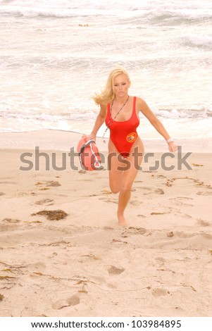 Katie Lohmann  on Halloween, wearing an authentic Baywatch swimsuit from the TV series, Zuma Beach, CA. 10-31-09