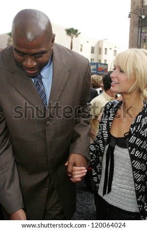 Magic Johnson and Paris Hilton at the Ceremony Honoring Los Angeles Lakers Owner Jerry Buss with the 2,323rd star on the Hollywood Walk of Fame. Hollywood Boulevard, Hollywood, CA. 10-30-06