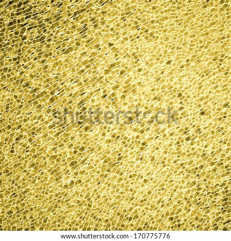 abstract gold glitter background with bumpy texture, glass or glossy shiny background, speckled detailed metallic effect, sparkly festive Christmas lights background decoration, luxury gold background