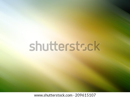 brilliant motion blur background green white gold and orange colored streaks of light