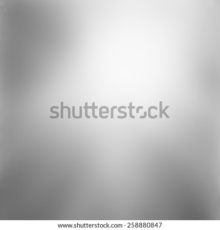 abstract shiny silver gray background with smooth blurred texture, black and white monochrome print background template