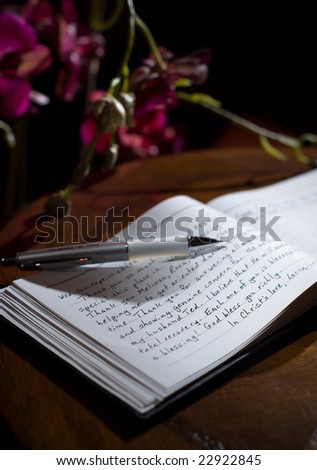 Guest-book with 'thank you' notes and orchids