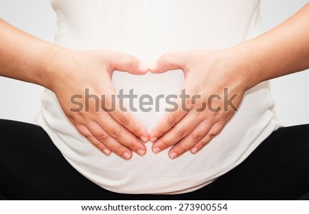 Pregnant Belly with fingers Heart symbol.(Clipping path)