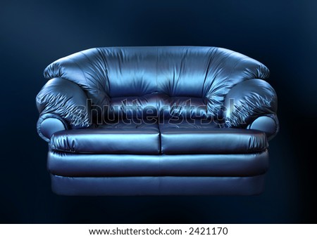 Blue sofa on a black background