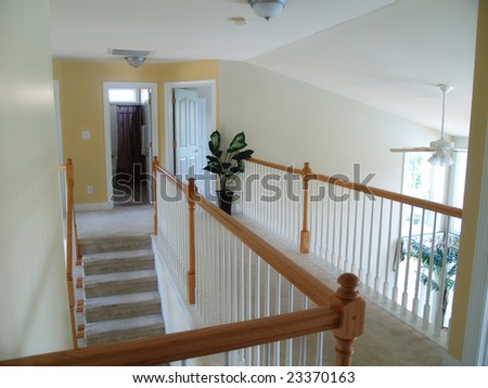 View from an interior balcony of the landing overlooking the family room