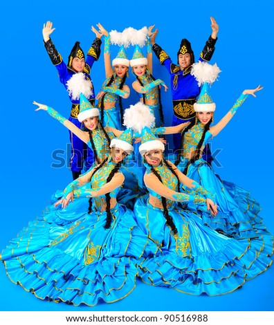 Eight people in the Kazakh national costumes