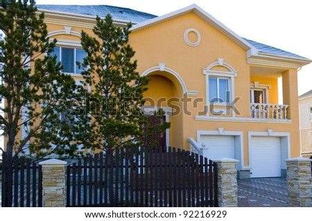 big orange house with two garages