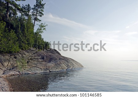 Rocky shore of Superior Lake at sunset