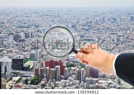 cityscape view through magnifying glass