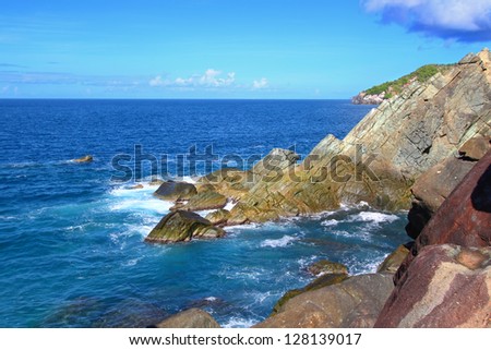 Waves crash over huge boulders at Shark Bay National Park in the British Virgin Islands