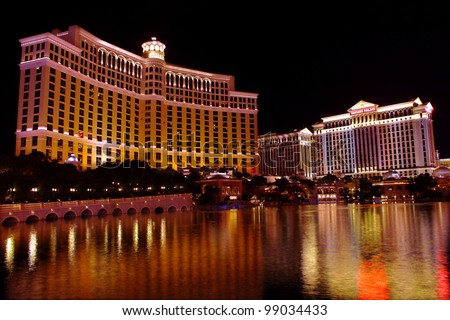 Las Vegas, USA - November 30, 2011:  A large fountain pool is situated in front of the Bellagio Hotel with neighboring Caesars Palace Hotel seen on the right on November 30, 2011 in Las Vegas.