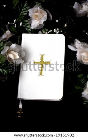 White Bible on black background