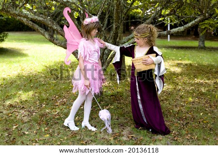 A young maiden finds a pink fairy.