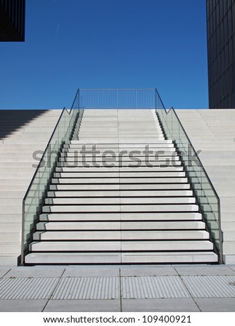 Stairway out of concrete in bright sunshine