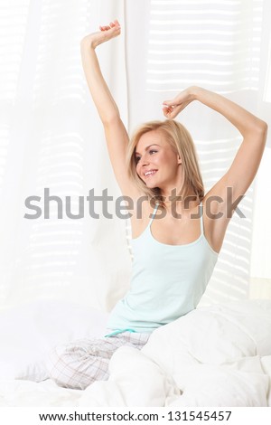 attractive woman stretching in the morning and is smiling