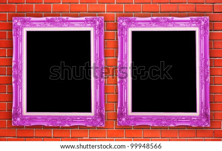 two purple frame picture with wall brick background