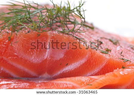 Closeup of a whole piece of smoked salmon with dill
