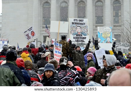 MADISON, WI - FEB 26:Protesters in Wisconsin during a rally against Governor Scott Walker's budget bill on Feb 26, 2011. Walker has won the recall election, but he still faces a new election next year