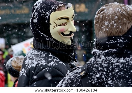 MADISON, WI - FEB 26:Protester wearing Anonymous mask in Wisconsin during a rally against Governor Scott Walker\'s budget bill on Feb 26, 2011. Walker  still faces a new election next year