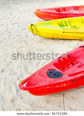 Kayaks on a beach in Thailand.