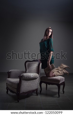 Girl posing with retro furniture
