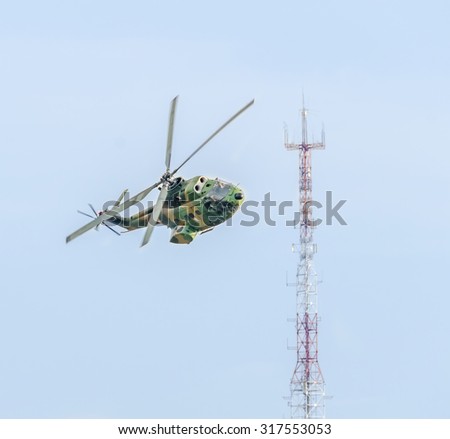 BUCHAREST, ROMANIA - SEPTEMBER 5, 2015. Aerobatic elicopter pilots training in the sky of the city. Puma elicopter, navy, army drill.