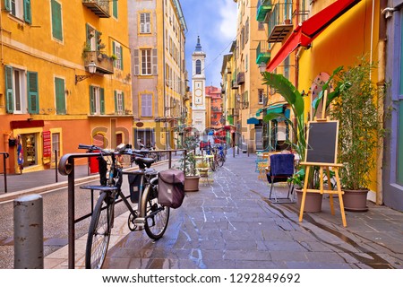 Nice colorful street architecture and church view, tourist destination of French riviera, Alpes Maritimes depatment of France 商業照片 © 