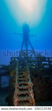 Underwater shipwrecks crows nest with a ladder in the foreground and a blue water background in Key Largo, Florida. The Coast Guard Cutter Duane in John Pennekamp State Park.