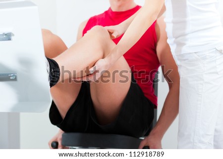 Patient at the physiotherapy making physical exercises with his therapist